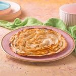 Flaky, multi-layered Indian bread, perfectly crisp on the outside and soft on the inside, ideal for pairing with any curry.