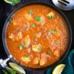 Spicy and tangy chicken curry cooked with vinegar, potatoes, and a bold blend of aromatic spices.