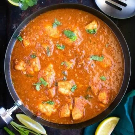 Spicy and tangy chicken curry cooked with vinegar, potatoes, and a bold blend of aromatic spices.