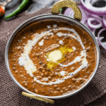 Creamy and rich black lentils slow-cooked with butter, cream, and aromatic spices for a classic Indian delicacy.