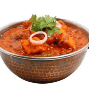 Spicy and flavorful fish curry cooked with a robust blend of Kolhapuri spices and coconut, garnished with fresh herbs.