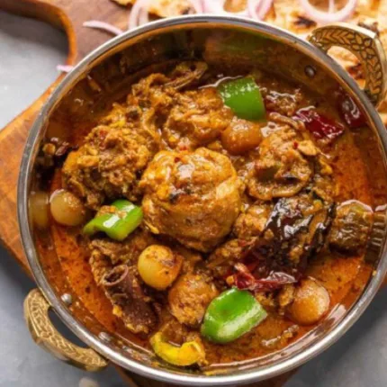 Tender chicken cooked with bell peppers, onions, and a bold blend of aromatic spices in a traditional wok