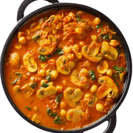 A flavorful curry of tender mushrooms and green peas cooked in a spiced tomato-based gravy.