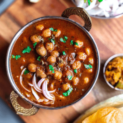 Spiced chickpea curry cooked with onions, tomatoes, and aromatic Punjabi spices for a hearty and flavorful dish.