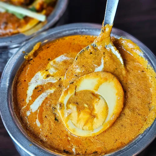 Boiled eggs simmered in a rich, creamy butter-based tomato gravy infused with aromatic spices.