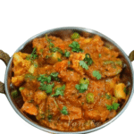 A spicy and flavorful curry made with mixed vegetables cooked in a rich Kolhapuri-style gravy infused with bold spices.