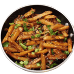 Crispy potato strips tossed in a sweet and spicy honey-chili sauce, garnished with sesame seeds.